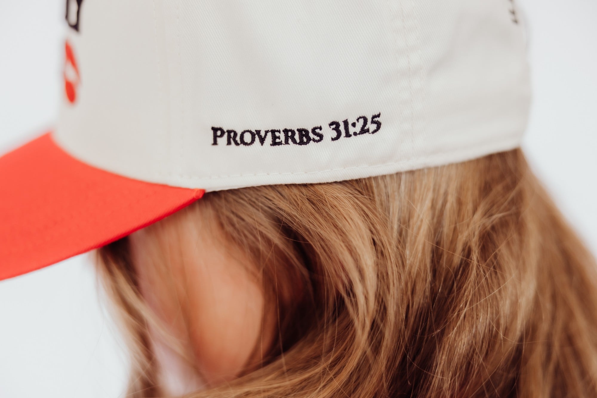 A Boldly Her cap embroidered with the reference Proverbs 31:25