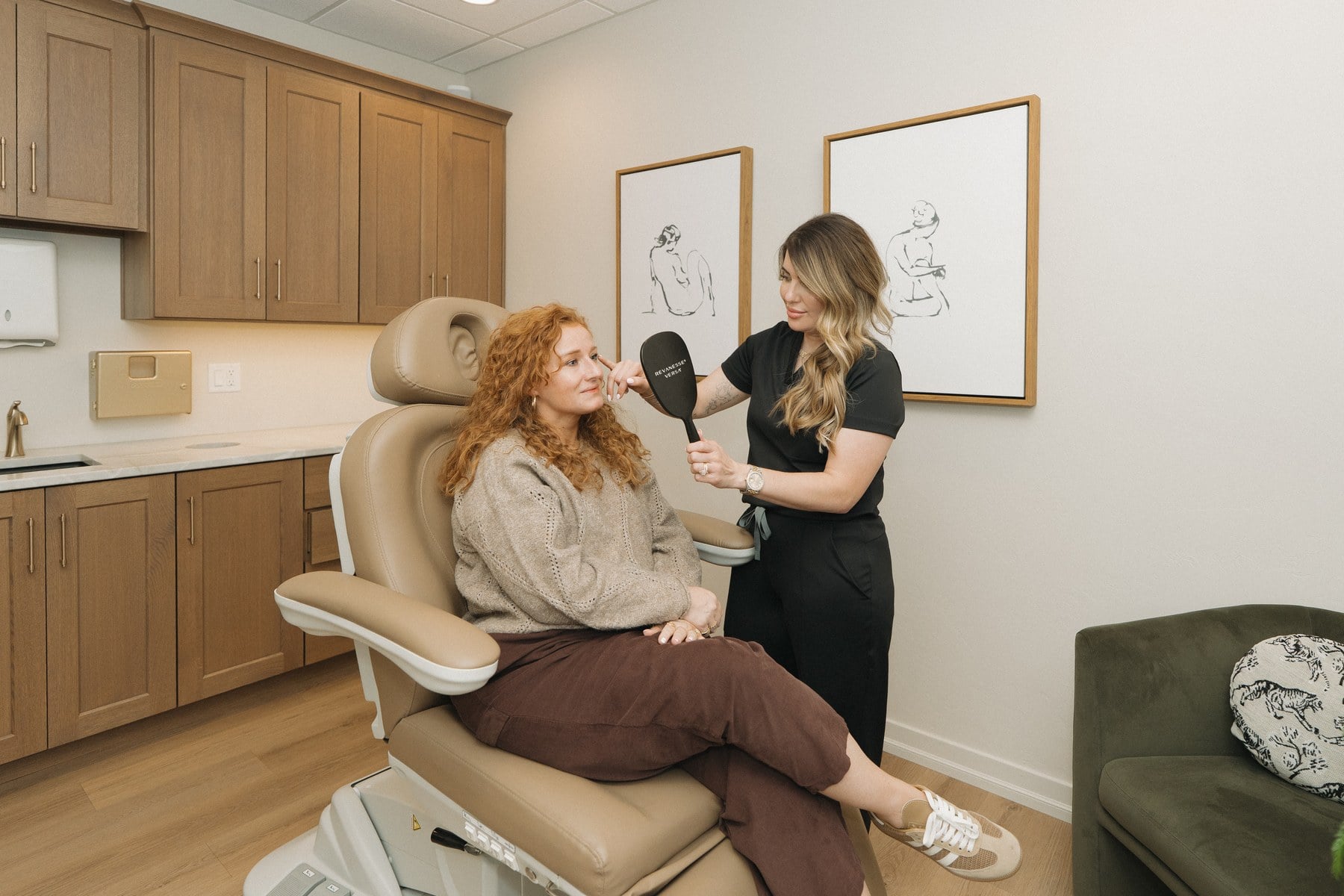 A provider and client reviewing a weight loss plan in a consultation room at Illumatox in Neenah