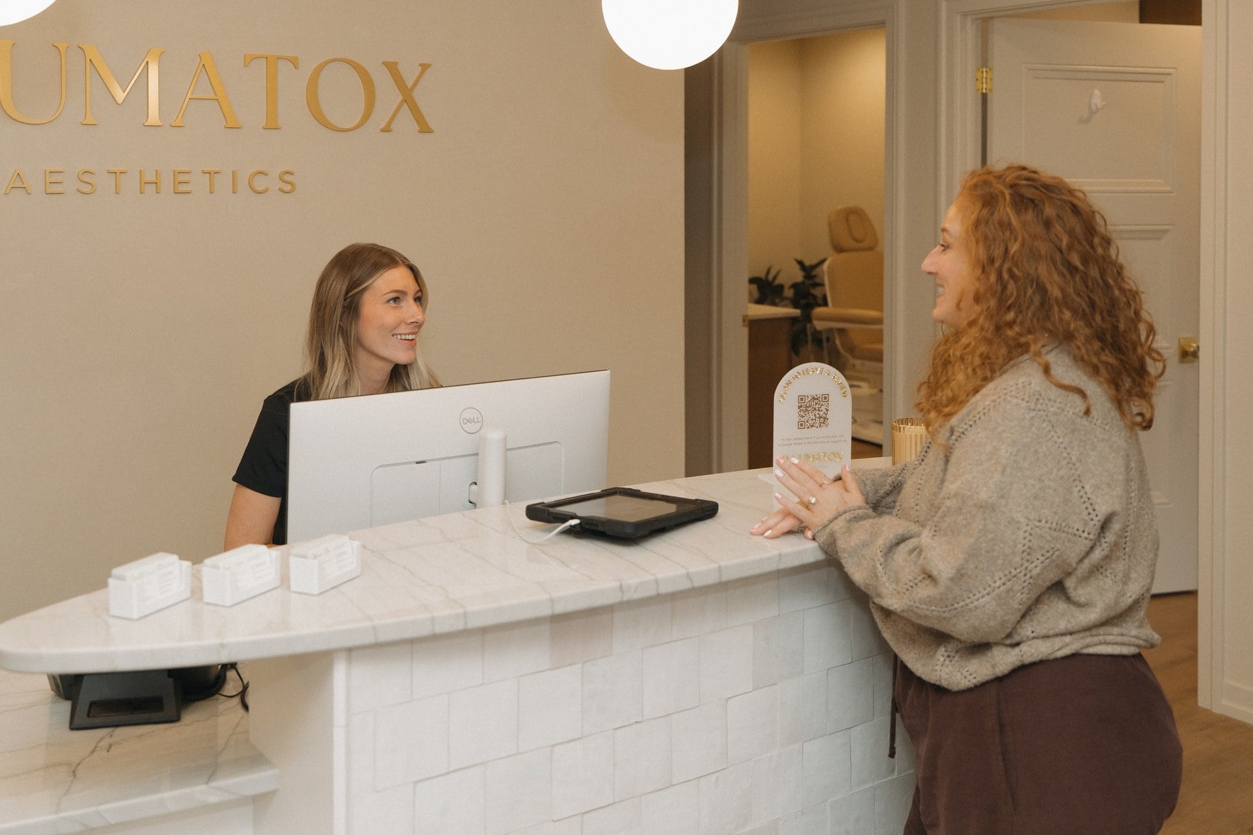 The reception area at Illumatox Aesthetic Studio in downtown Neenah