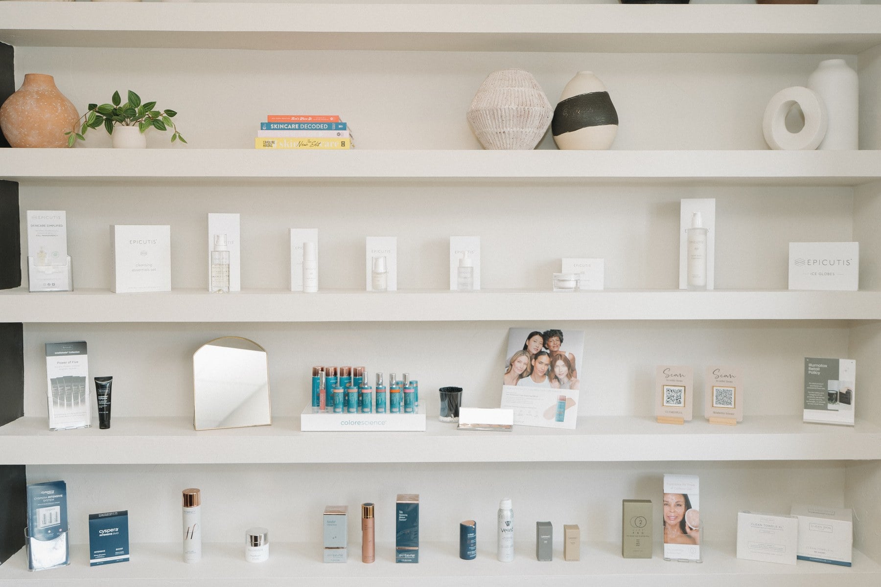 The medical-grade skincare retail wall at Illumatox Aesthetic Studio in Neenah