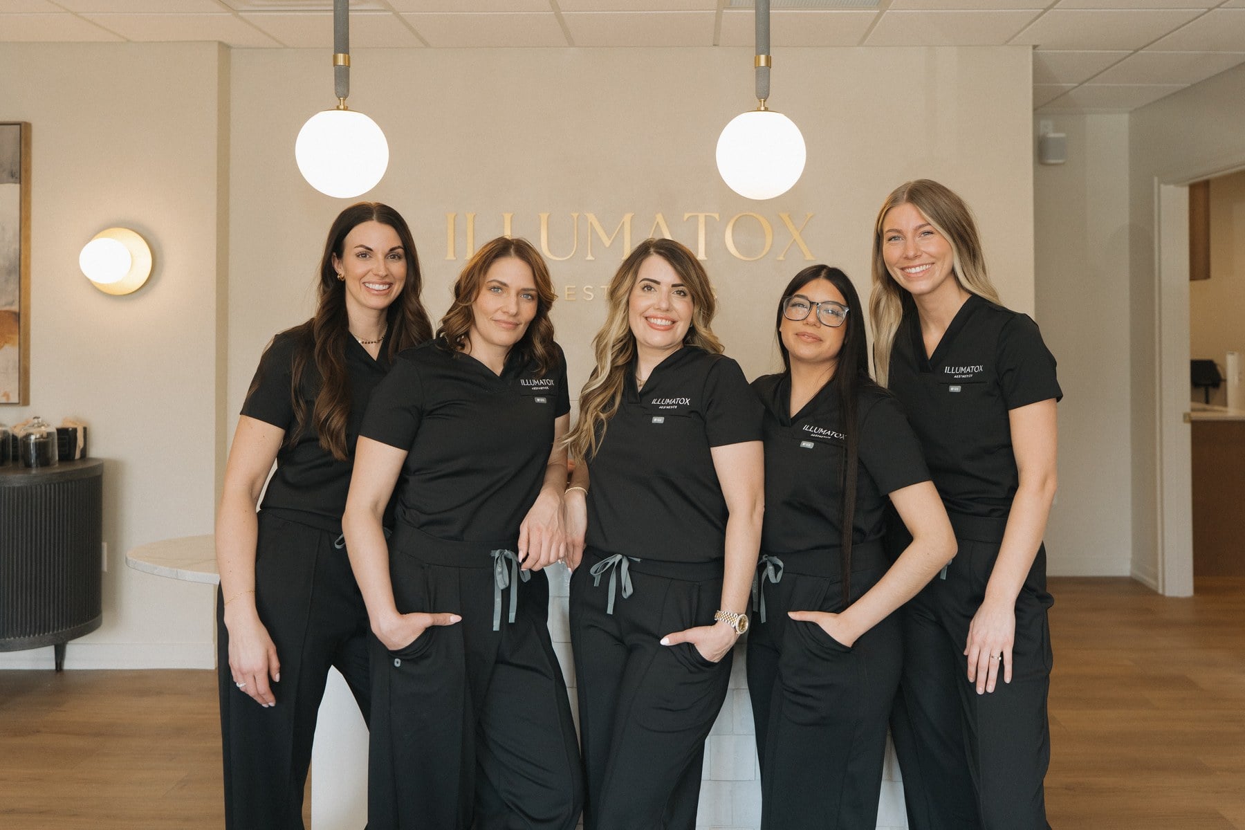 The Illumatox team at the front desk of the Neenah studio