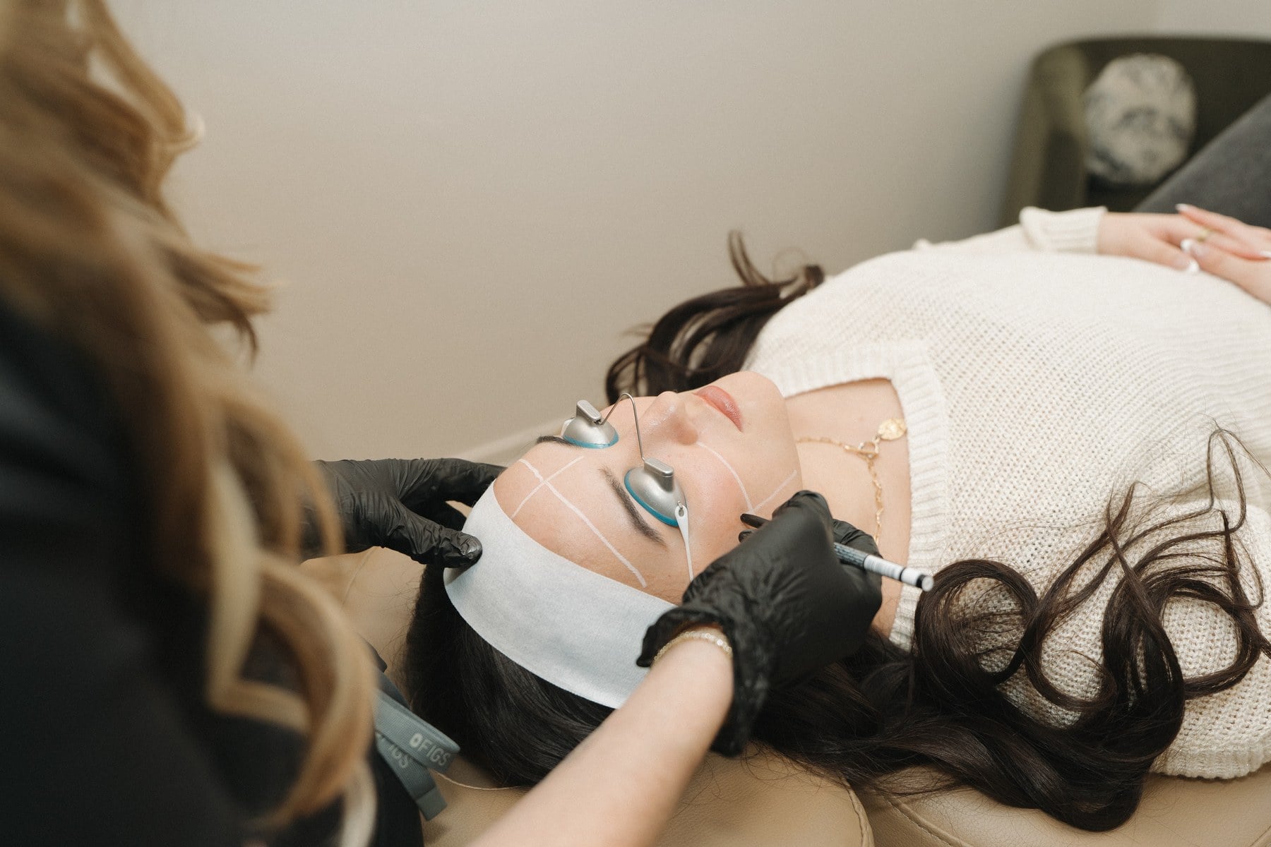 A resurfacing handpiece being used across the cheek at Illumatox in Neenah