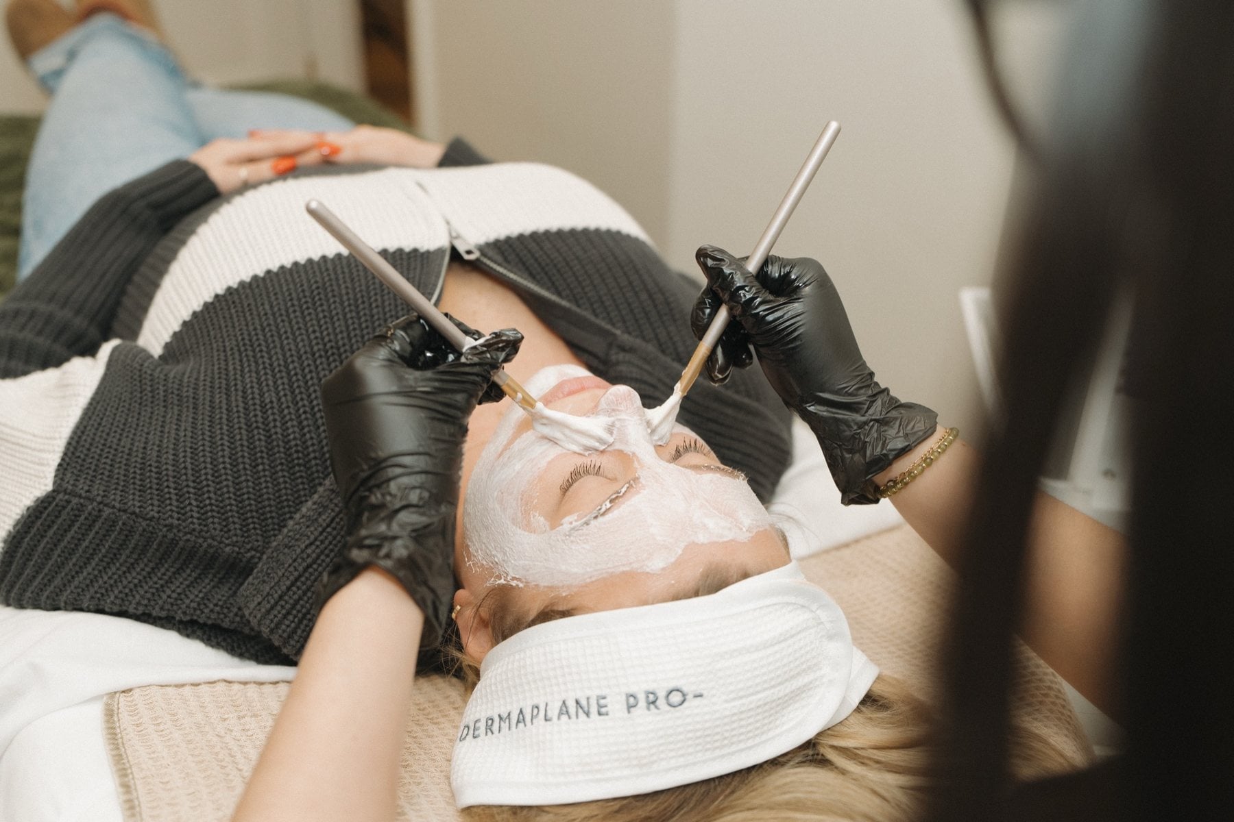 A facial treatment being performed at Illumatox Aesthetic Studio in Neenah